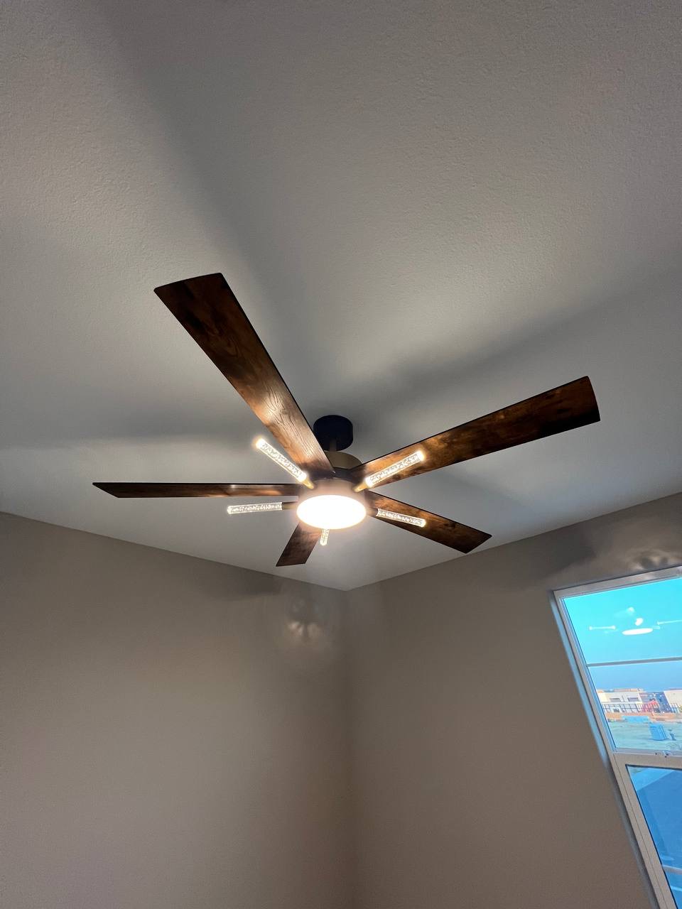 Ceiling fan and light fixture installation, and replacement of outdated lights with modern fixtures.
